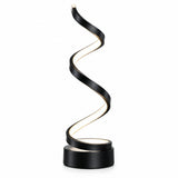 Maviq Aetheria spiral LED table lamp styled on a wooden table